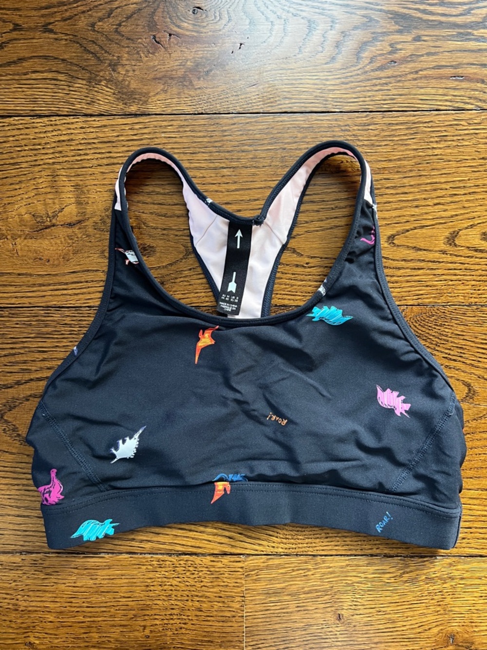 Black Racerback Sports Bra with Multicolor Dino Accents